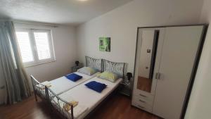 Postel nebo postele na pokoji v ubytování Apartments Veronika
