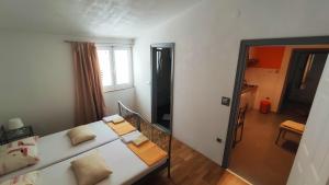 Postel nebo postele na pokoji v ubytování Apartments Veronika