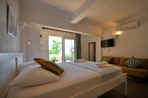 Кровать или кровати в номере Kaktus Beach Apart