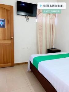 Postel nebo postele na pokoji v ubytování Hotel San Miguel Apartadó
