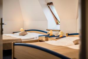 Postel nebo postele na pokoji v ubytování IT Centrum Apartments