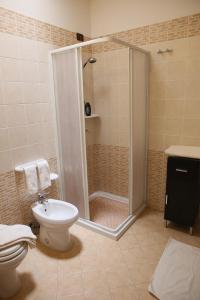 a bathroom with a shower and a toilet and a sink at B&B Minerva in Castro di Lecce