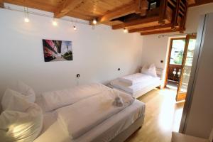 A bed or beds in a room at Chalet Gaisberg by Apartment Managers