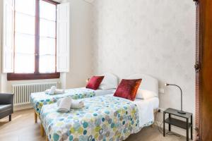 Posteľ alebo postele v izbe v ubytovaní I Renai - Ponte delle Grazie Modern Apartment