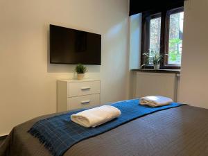 Postel nebo postele na pokoji v ubytování Milla Apartments