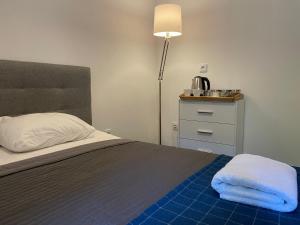 Postel nebo postele na pokoji v ubytování Milla Apartments