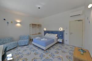Postel nebo postele na pokoji v ubytování Acquadamare B&B