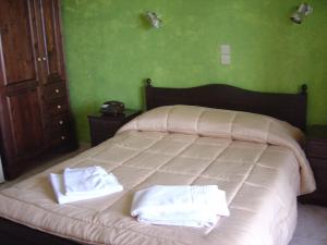 Ένα ή περισσότερα κρεβάτια σε δωμάτιο στο Πόρτο Λουρμπά