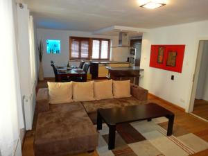 a living room with a couch and a table at Apartment Kirchberg by Apartment Managers in Kirchberg in Tirol