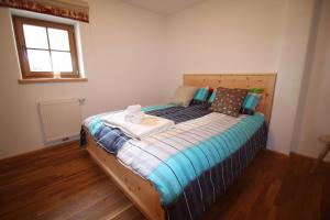 A bed or beds in a room at Apartment Jochberg by Apartment Managers