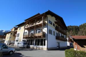 a large building with a parking lot in front of it at Apartment Kitzbichler by Apartment Managers in Kitzbühel