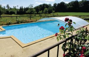 a swimming pool with a cover over it at Gorgeous Home In Domfront En Champagne With Kitchen in Domfront-en-Champagne