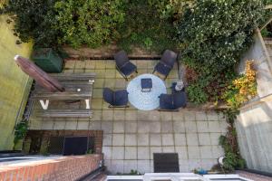 an overhead view of a patio with a table and chairs at Hosted by Wendy Prins Willem 1 in Scheveningen