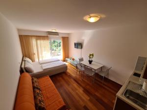 TV a/nebo společenská místnost v ubytování Apartments Veronika