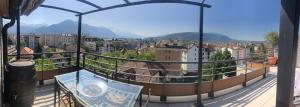 a balcony with a view of a city at Annecy centre, Appartement en attique avec vue panoramique in Annecy