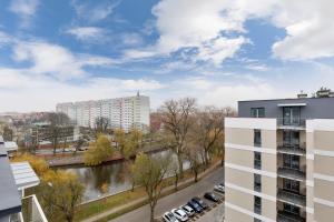 a view of a river from a building at Apartament Premium Platany by Renters in Kołobrzeg