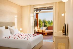 a bedroom with a bed and a balcony at Monte Santo Resort in Carvoeiro