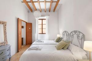 Postel nebo postele na pokoji v ubytování Villa Santanyí, Sueño de Verano