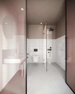 a bathroom with a shower and a toilet and a sink at Alinea Urban Saripolou Square in Limassol