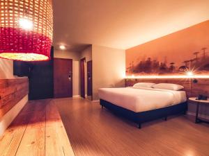Cama ou camas em um quarto em Hotel Cassino Tower Curitiba Aeroporto By Nacional Inn