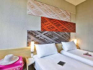 Postel nebo postele na pokoji v ubytování Ibis Maringa