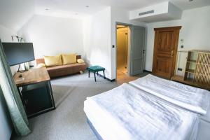 Postel nebo postele na pokoji v ubytování Hotel Gabriella