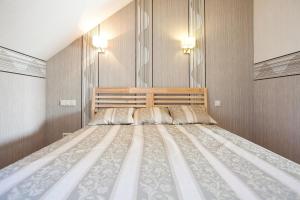 Un pat sau paturi într-o cameră la Liepas