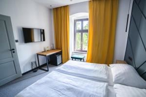 Postel nebo postele na pokoji v ubytování Hotel Gabriella