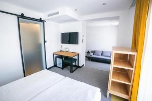 TV a/nebo společenská místnost v ubytování Hotel Gabriella