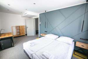 Postel nebo postele na pokoji v ubytování Hotel Gabriella