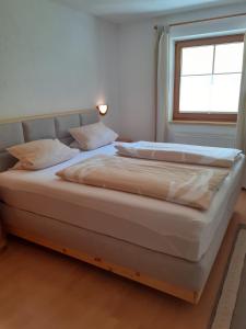 En eller flere senge i et værelse på Apart Brugger