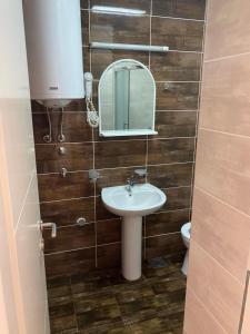 a bathroom with a sink and a mirror at Apartment Iva in Boreti +8 photos