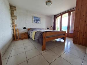 Postel nebo postele na pokoji v ubytování Ô Panoragite - Gîte familial