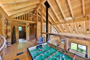 an overhead view of a billiard room in a log cabin at Chalet Rothenbach in Mittlach