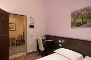 Łóżko lub łóżka w pokoju w obiekcie Hotel Tonic