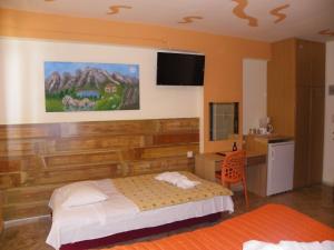 Ένα ή περισσότερα κρεβάτια σε δωμάτιο στο Mirabelle Hotel