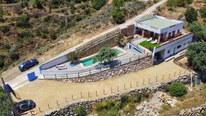 an aerial view of a house with a swimming pool at Villa for 4 with a private Pool & Garden in Bédar