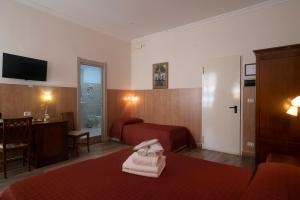 Łóżko lub łóżka w pokoju w obiekcie Hotel Tonic
