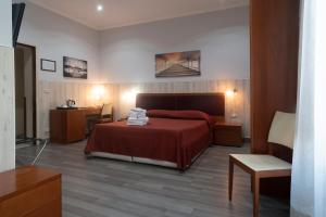Łóżko lub łóżka w pokoju w obiekcie Hotel Tonic