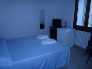 Postel nebo postele na pokoji v ubytování Hotel L'Ancora