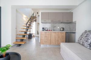 A kitchen or kitchenette at Aelia Seaside Luxury Suites