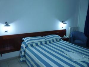 Postel nebo postele na pokoji v ubytování Hotel L'Ancora