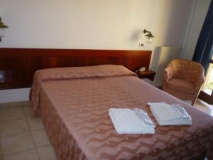 Postel nebo postele na pokoji v ubytování Hotel L'Ancora