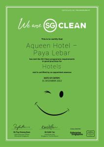 a green flyer with a smiley face at Aqueen Hotel Paya Lebar in Singapore
