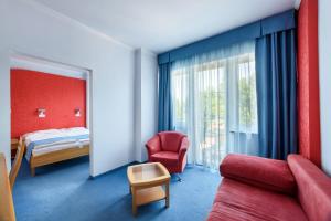 Postel nebo postele na pokoji v ubytování Hotel Négy Évszak