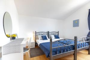 Postel nebo postele na pokoji v ubytování Apartments Villa Maja