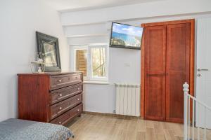 Postel nebo postele na pokoji v ubytování Apartman Sidonija
