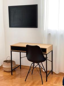 Televízia a/alebo spoločenská miestnosť v ubytovaní Apartman Welcome to Trešnjevka
