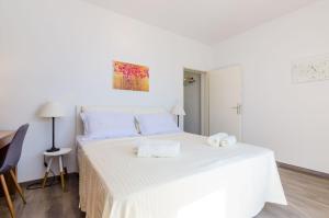 Posteľ alebo postele v izbe v ubytovaní Apartments Knego