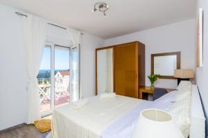 Posteľ alebo postele v izbe v ubytovaní Apartments Knego
